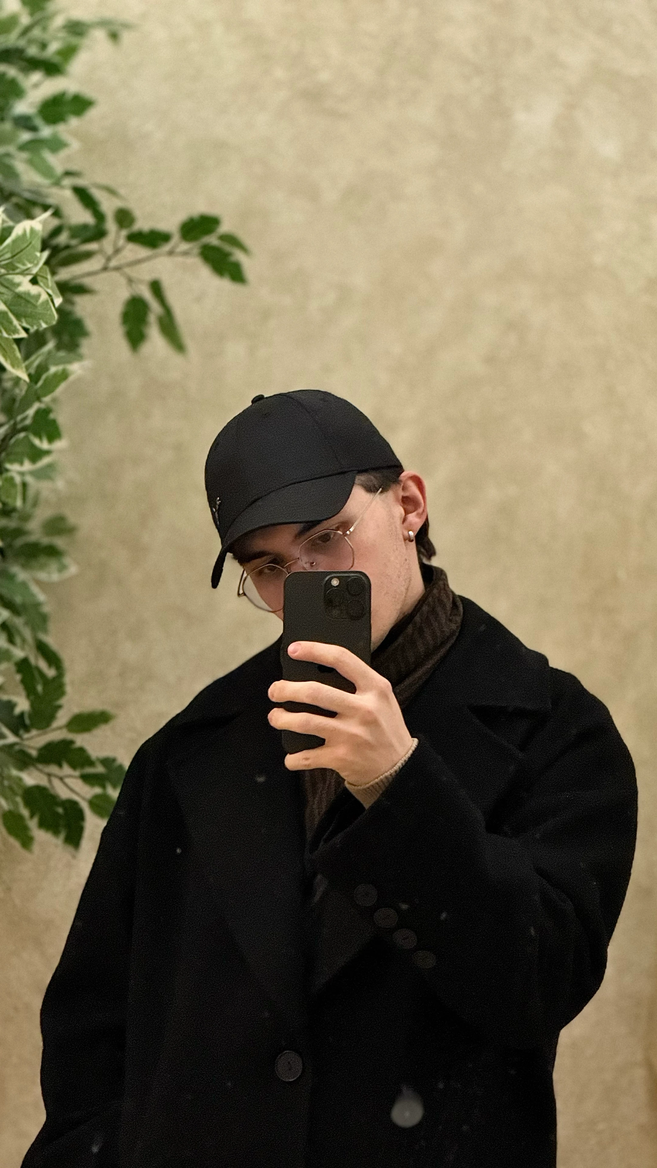 Azat Akhmetzianov in a black coat and cap